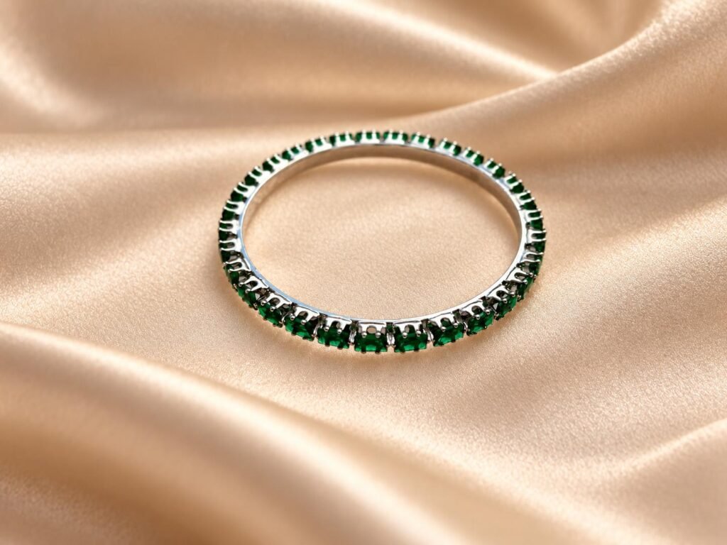 Silver toned green stone bangle. Size(2 x 6)